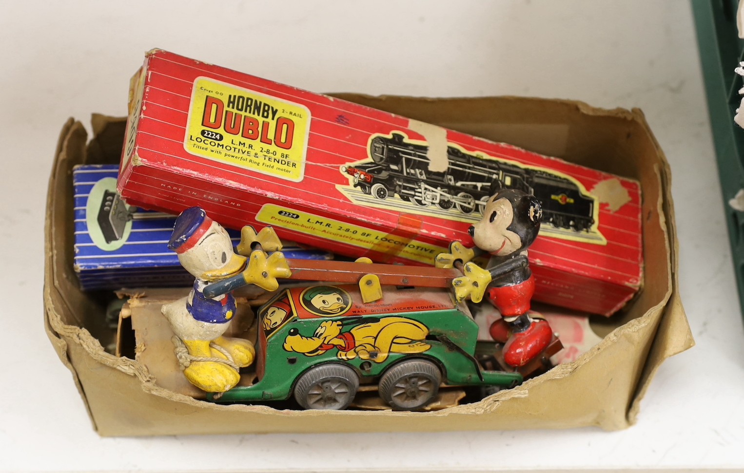 A Dublo Hornby locomotive, a quantity of tack etc and a Walt Disney made in Britain tin windup toy of Mickey Mouse and Donald Duck